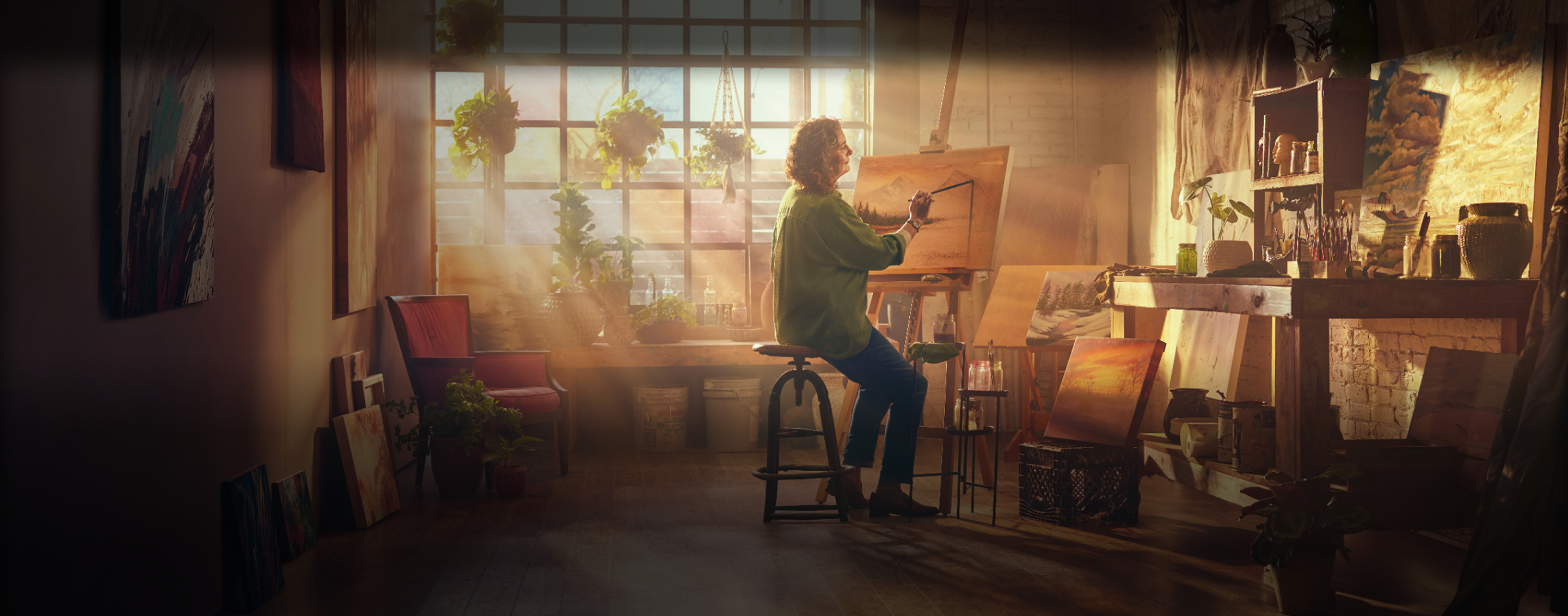 Woman painting at golden hour